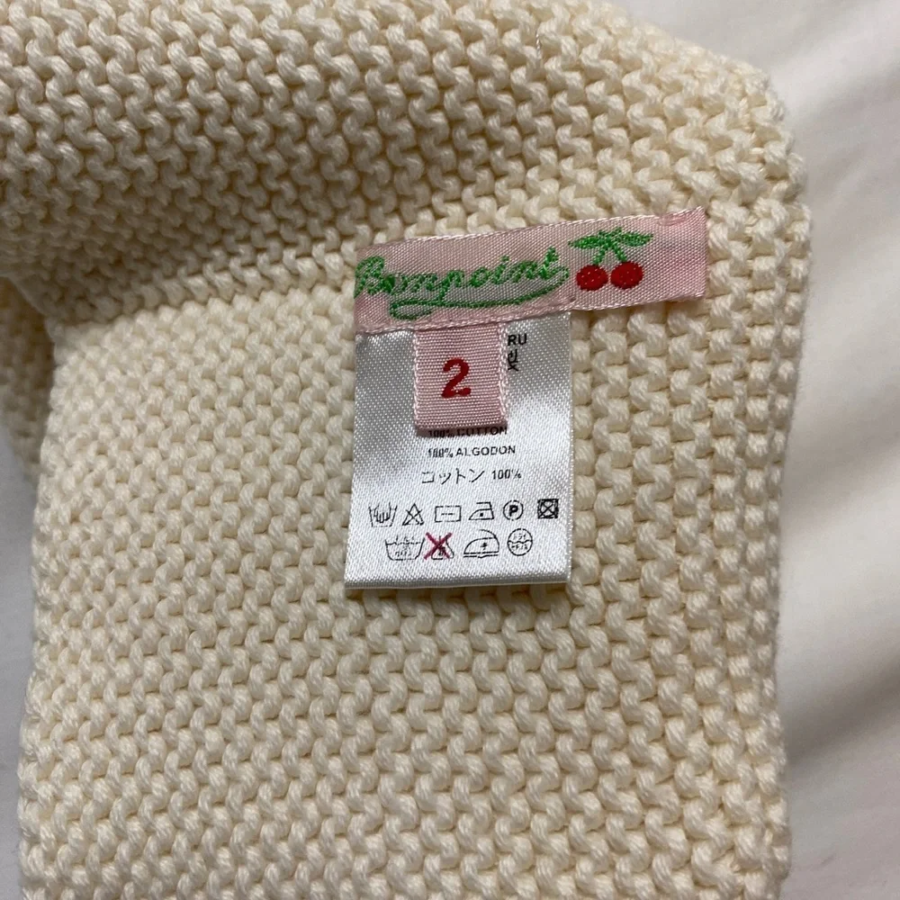 Bonpoint cream knit beanie with button detail